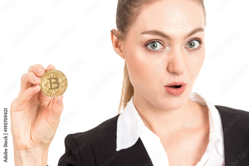 Businesswoman holding golden bitcoin in her hand isolated on white background Businesswoman holding golden bitcoin in her hand isolated on white background