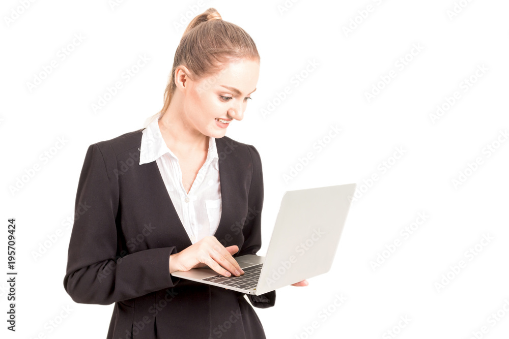 Smiling businesswoman using a laptop computer isolated on white background Smiling businesswoman using a laptop computer isolated on white background