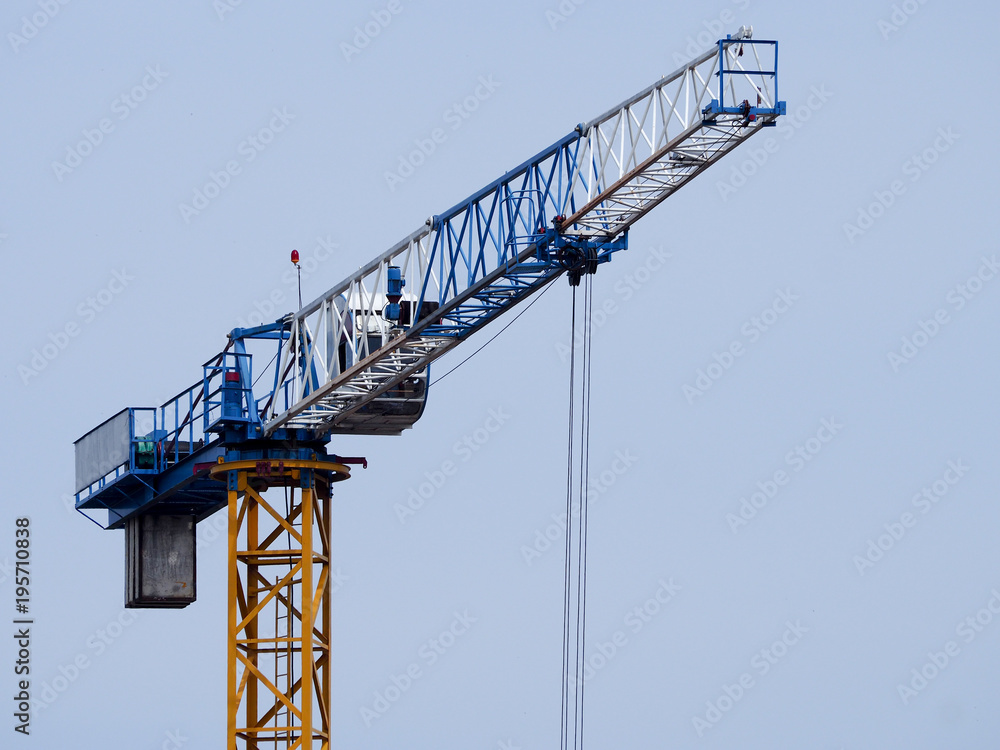 A crane against a blue sky background A crane against a blue sky background