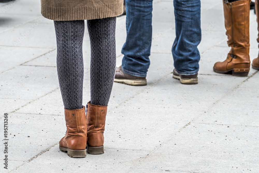 Fashion look of girl dressed in casual style in short skirt and broun boots Fashion look of girl dressed in casual style in short skirt and broun boots