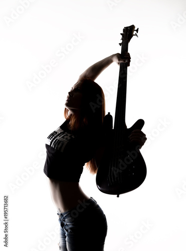 silhouette of rock woman playing on electric guitar on a white background.