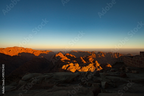 Mountains lit by first rays of sun at sunrise.