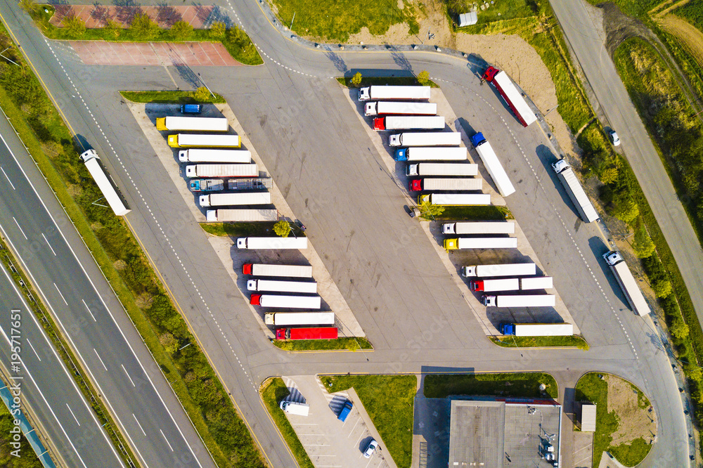 Fototapeta premium Aerial view of highway rest area with restaurant and large car park for cars and trucks. D5 motorway in west Bohemia, Czech republic, European union. Top view of highway infrastructure.