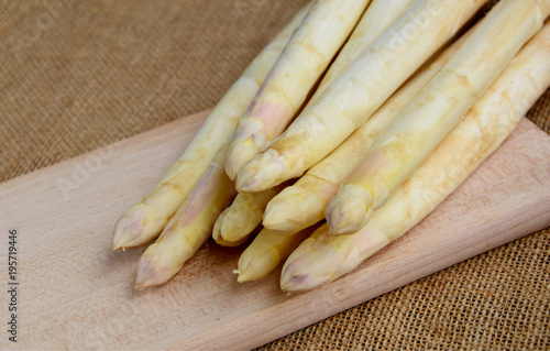 white Asparagus on wooden board