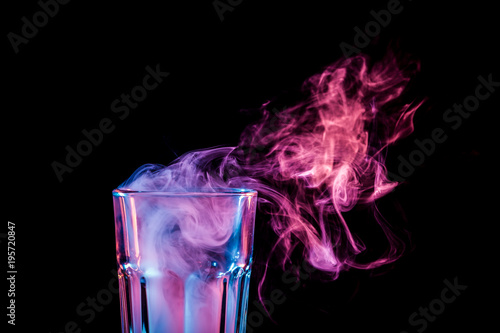 Картината върху платно A glass with colorful smoke
