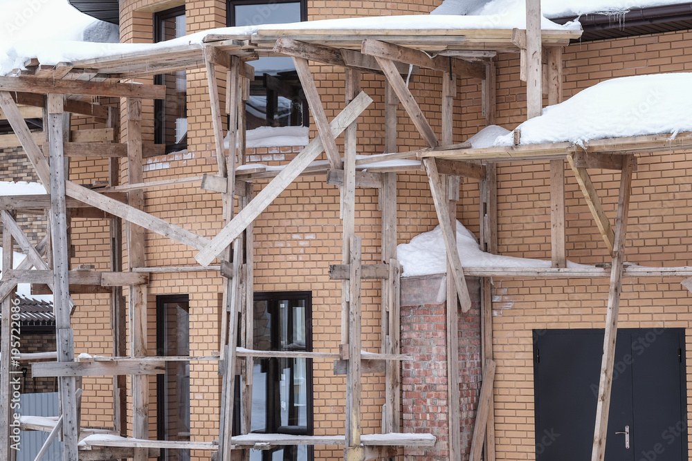 Obraz premium Facade of the house under construction.