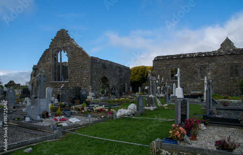 Lislaughtin Abbey with blue cloudy sky photo