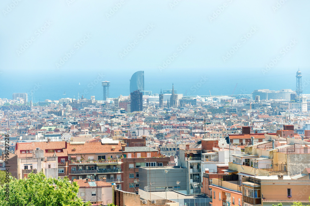 Panoramic view of city of Barcelona, cityscape with buildings and blue sea