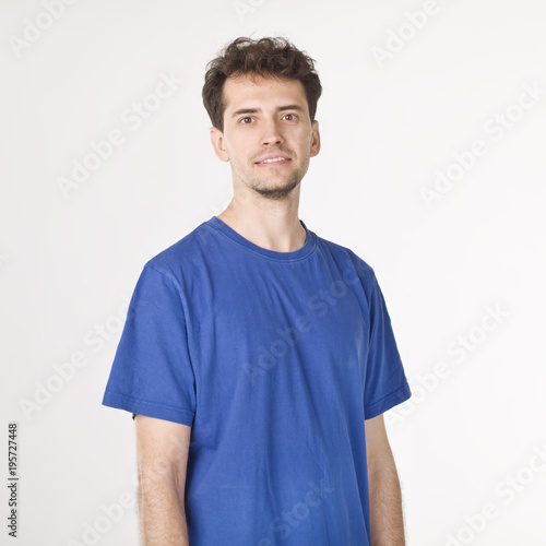 Attractive smiling boy in blue T-shirt