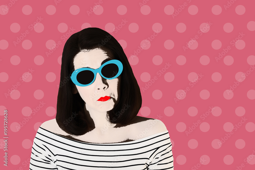 Photo in the style of pop art. Woman in a black and white striped top and blue sunglasses, pin up style.