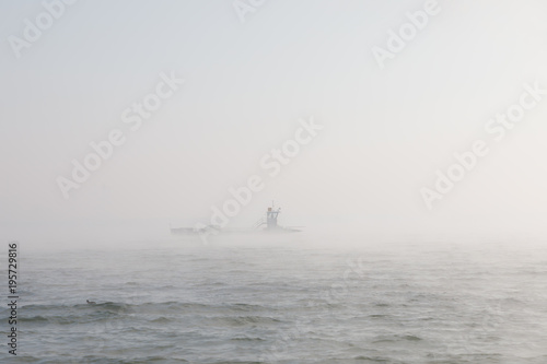 Car ferry on foggy lake Chiemsee