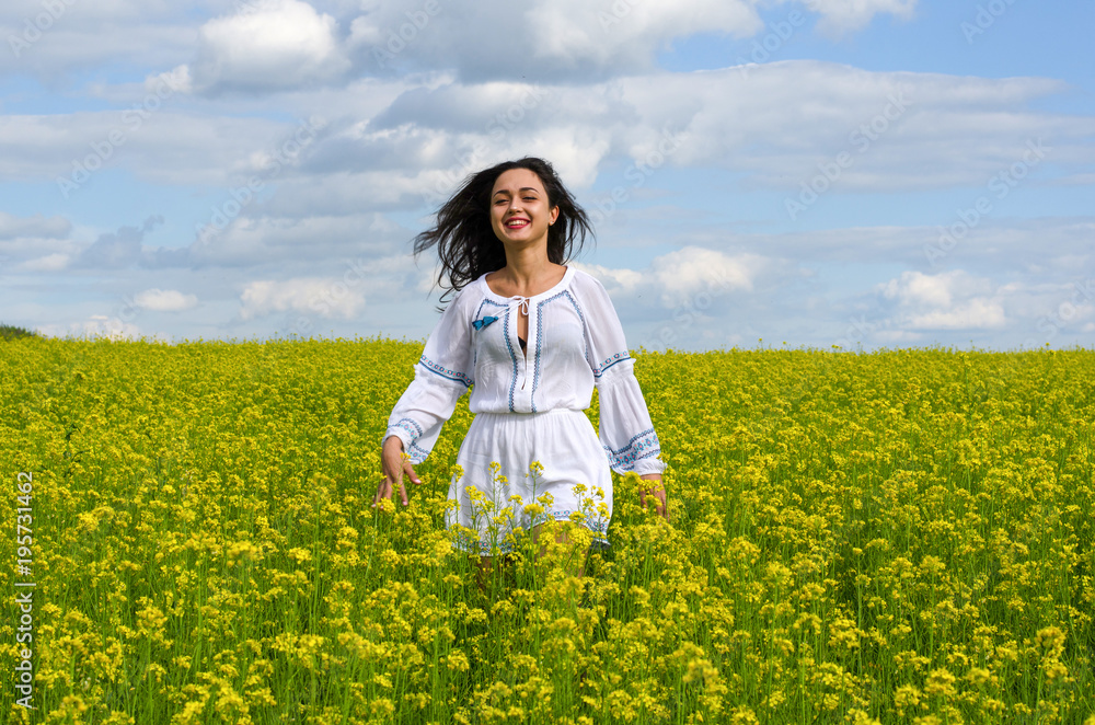 beautiful young girl in a white dress in a field of flowers beautiful young girl in a white dress in a field of flowers