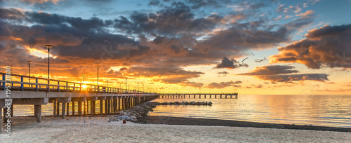 Colorful sunset at a famous marine pier in the Baltic resort city of Palanga  Lithuania  Europe