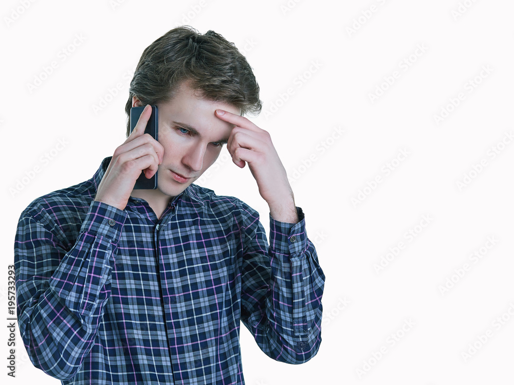 Close- up portrait of young, serious business man, corporate employee, student talking on mobile phone. Close- up portrait of young, serious business man, corporate employee, student talking on mobile phone.