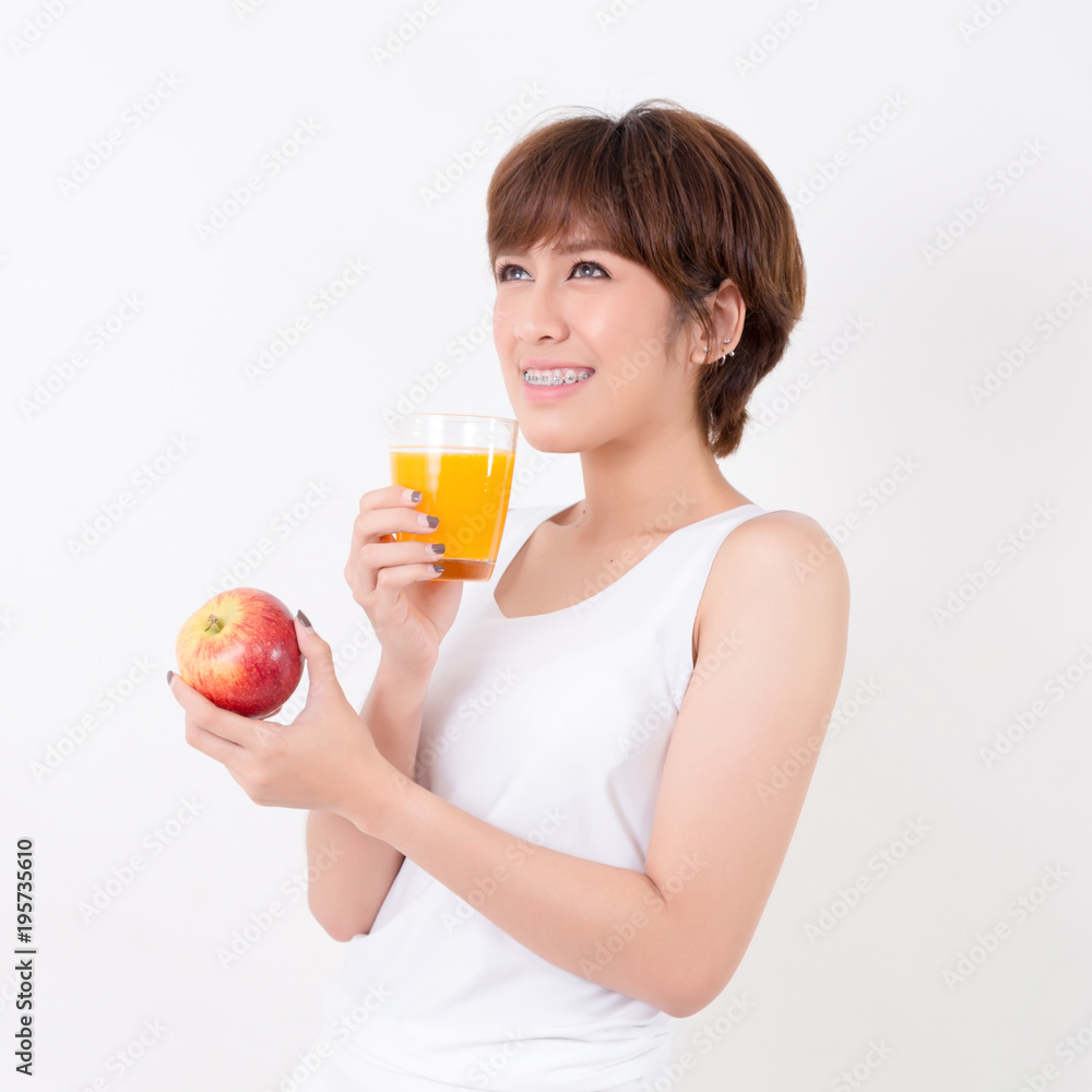 Beautifulyoung Asia woman with healthy food. Isolated on white background. Studio lighting. Concept for healthy. Beautifulyoung Asia woman with healthy food. Isolated on white background. Studio lighting. Concept for healthy.