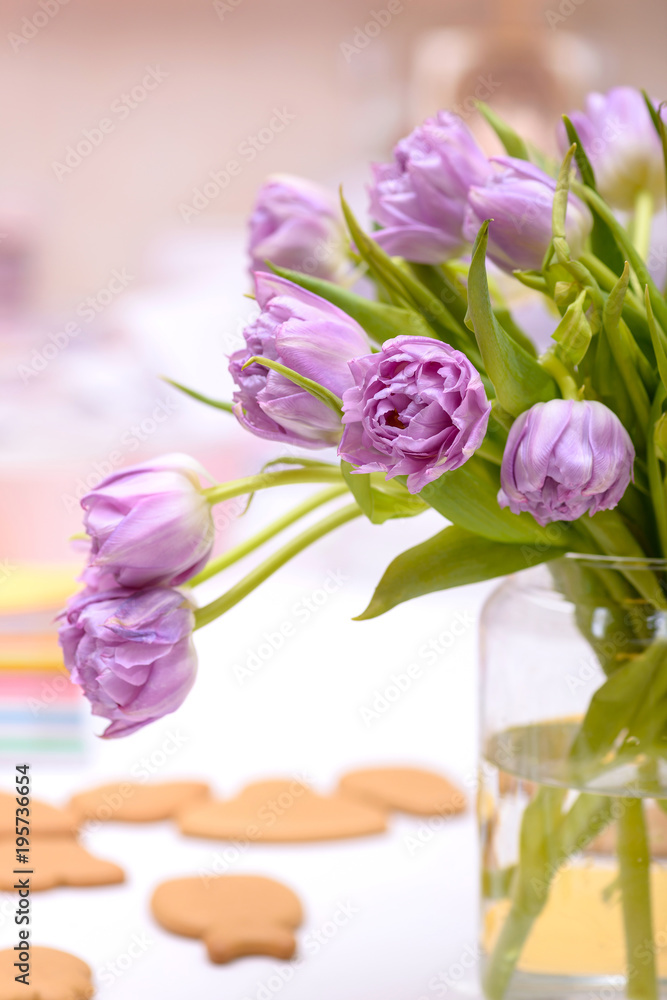 Close-up purple tulips in vase on table