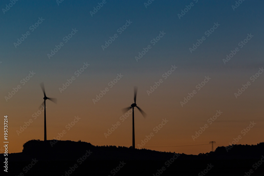 Obraz premium Wind turbines at sunrise