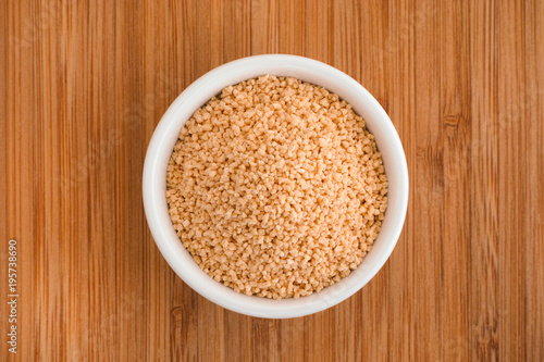 Foto Soy lecithin in a bowl on a wooden background