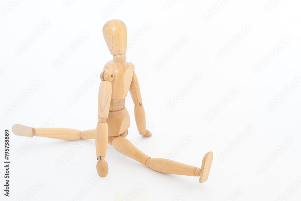 Wooden maniken sits on a string. Wooden maniken sits on a string.