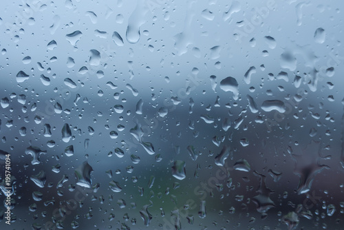 The texture of rain drops on the glass from the shower