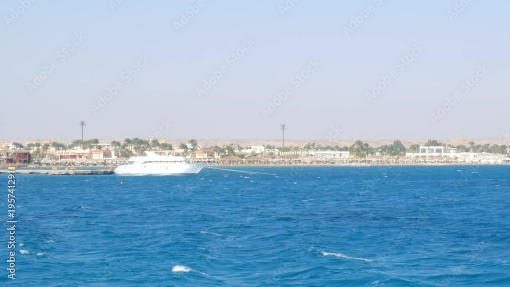 the Yacht Anchored Near the Beach the Yacht Anchored Near the Beach