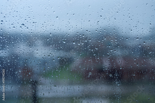 The texture of rain drops on the glass from the shower