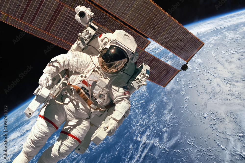 Naklejka premium International Space Station and astronaut.