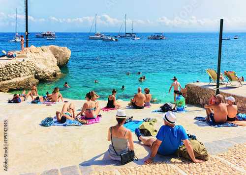 Fototapeta Naklejka Na Ścianę i Meble -  People relaxing at beach in Scopello Sicily