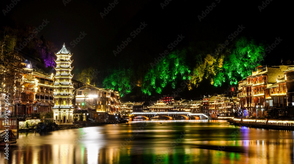 FENGHUANG, CHINA - JANUARY 26 2018 : View of shore of canal and Hong Rainbow bridge in Fenghuang(Especially name it’s mean Phoenix), It’s a old village with the wood house. China 