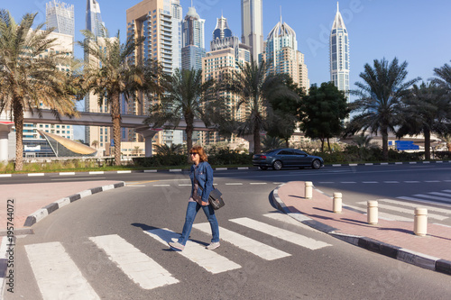 Young woman on the streets of Dubai at beautiful sunny morning