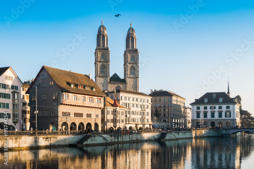 Limmat River Quay and Grossmunster Church in Zurich, Switzerland.