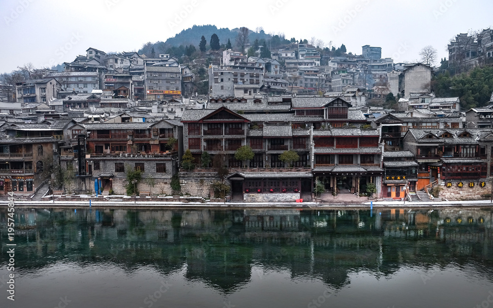 FENGHUANG, CHINA - JANUARY 26 2018 : View of shore of canal and Hong Rainbow bridge in Fenghuang(Especially name it’s mean Phoenix), It’s a old village with the wood house. China 