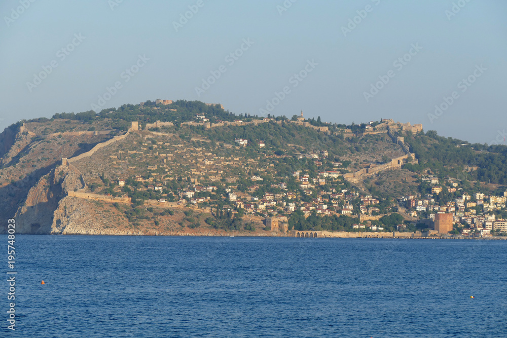 Blue sea, clear sky and beautiful homes up the hill, landcape
