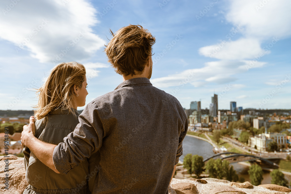 Fototapeta premium Young couple looking at panorama of city skyline Vilnius Lithuania