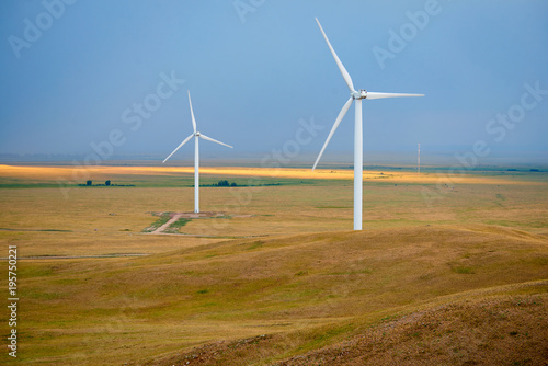 Wind power stations. Wind power is the use of air flow through wind turbines to mechanically power generators for electric power. 