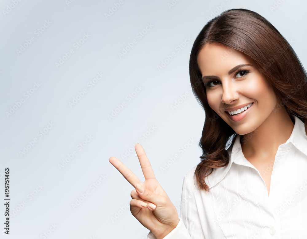 businesswoman, showing two fingers or victory gesture businesswoman, showing two fingers or victory gesture