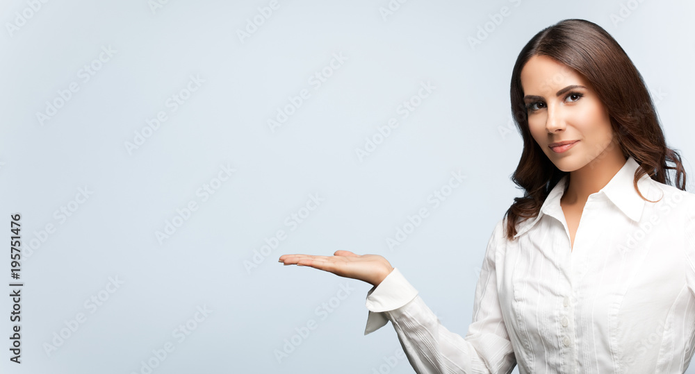 businesswoman, showing something or blank copyspace businesswoman, showing something or blank copyspace
