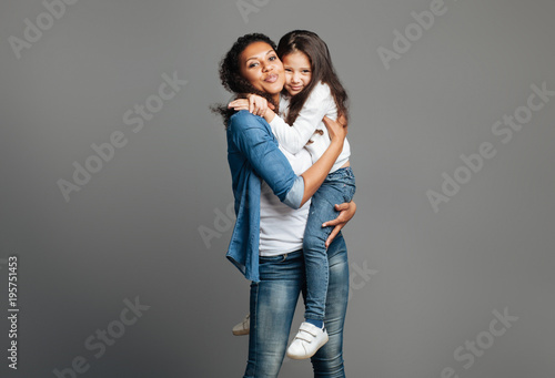 Nice loving mother holding her daughter