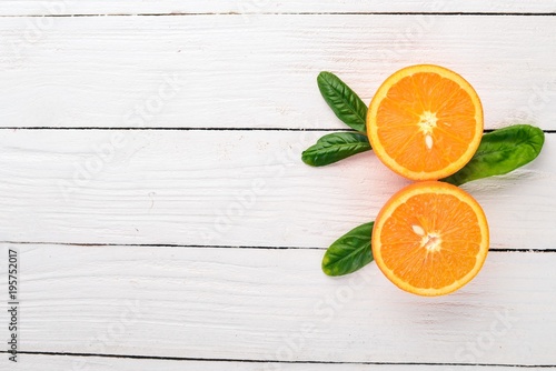 Fresh Orange. Fruits. On a wooden background. Top view. Copy space.