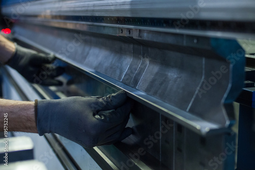 operator working cut and bending metal sheet