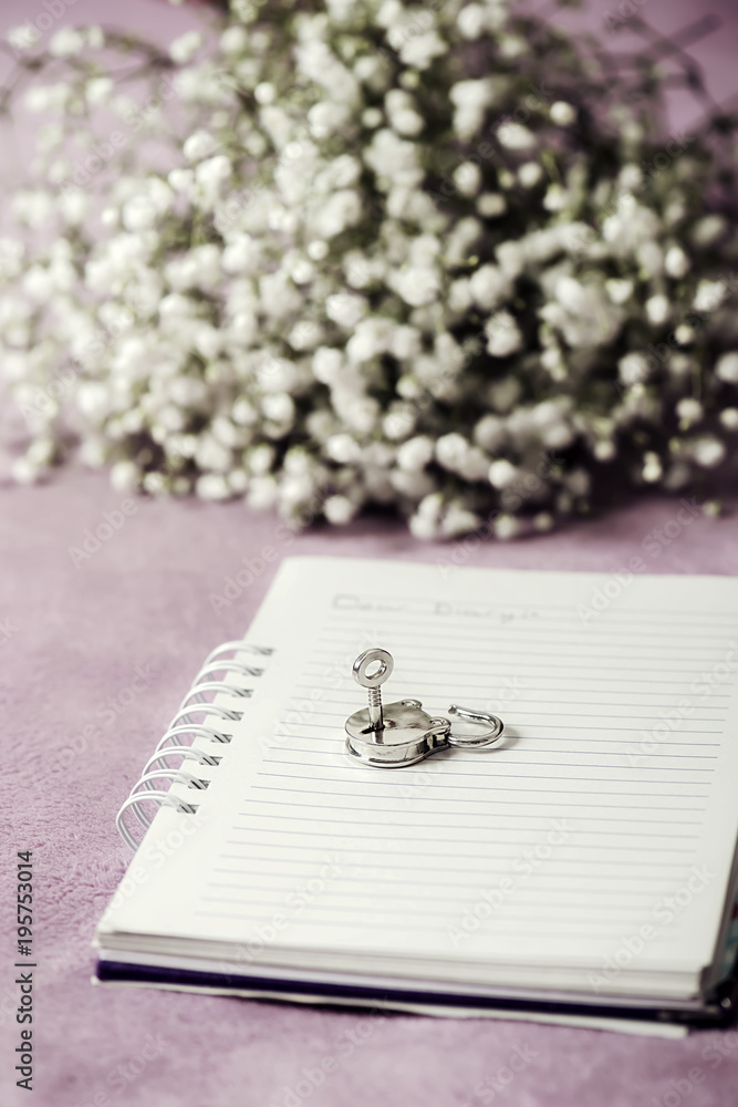 Diary of a teenager with white flowers background Diary of a teenager with white flowers background