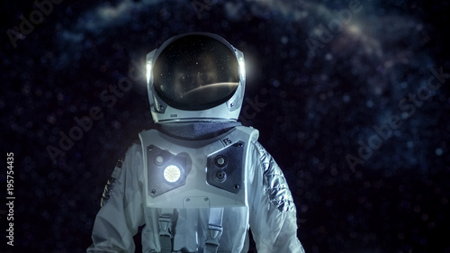 Fototapeta Naklejka Na Ścianę i Meble -  Courageous Astronaut in the Space Suit Stands on the Alien Planet. Milky Way Galaxy Behind Him. Exploring Newly Discovered Planet. Space Travel and Extraterrestrial Colonization Concept.