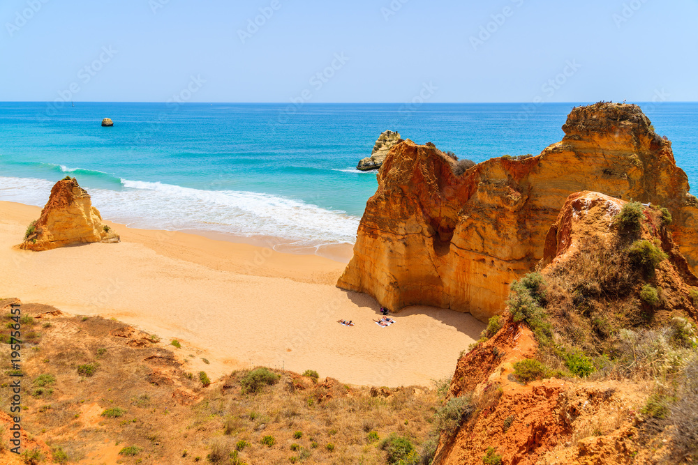 View of beautiful beach with rocks near Portimao town, Algarve, Portugal View of beautiful beach with rocks near Portimao town, Algarve, Portugal