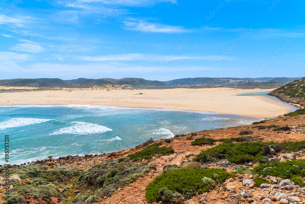 View of beautiful Praia da Bordeira beach, popular place to do kite surfing, Algarve, Portugal