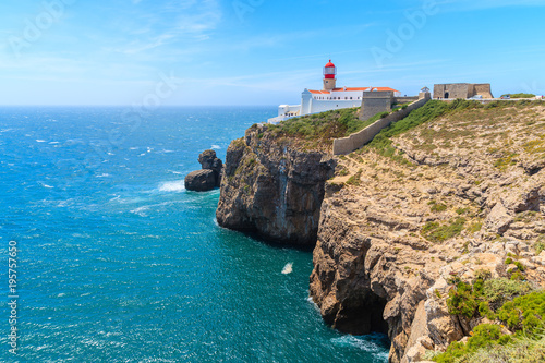 Blue sea and lighthouse on top of cliff at Cabo Sao Vicente  Algarve region  Portugal