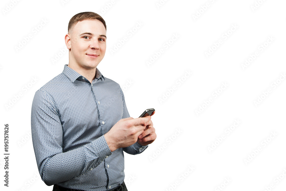 Young man looking at his smartphone. Isolated on white background. Young man looking at his smartphone. Isolated on white background.