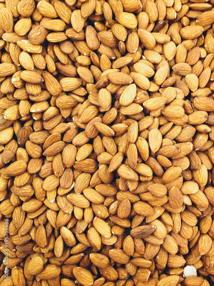 Closeup of whole almond nuts for background. Closeup of whole almond nuts for background.