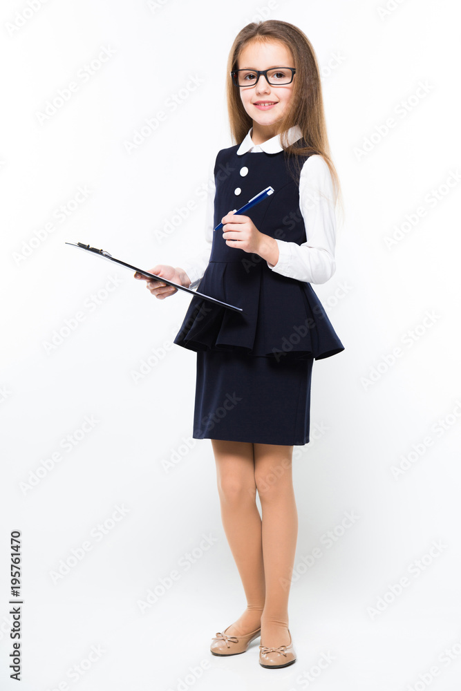 Little girl with pen and clipboard in her hands dressed as a businesswoman Little girl with pen and clipboard in her hands dressed as a businesswoman