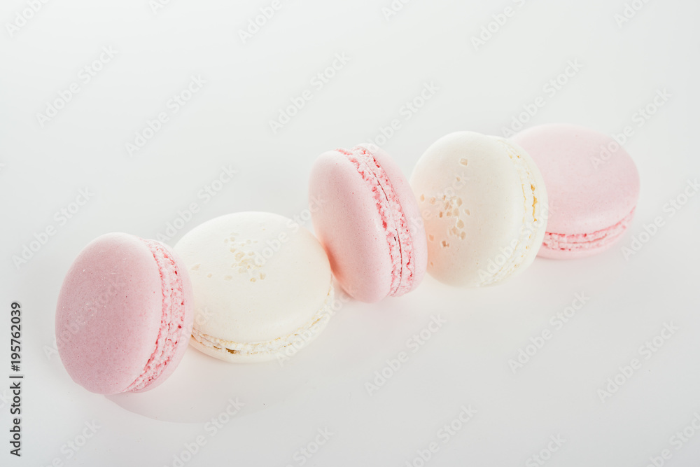 Exquisite french dessert, pink and cream macaron cakes Exquisite french dessert, pink and cream macaron cakes