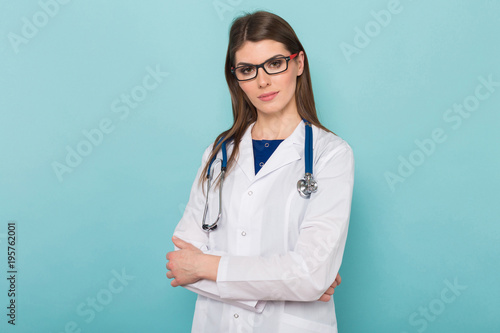 Attractive female doctor in white coat and glasses